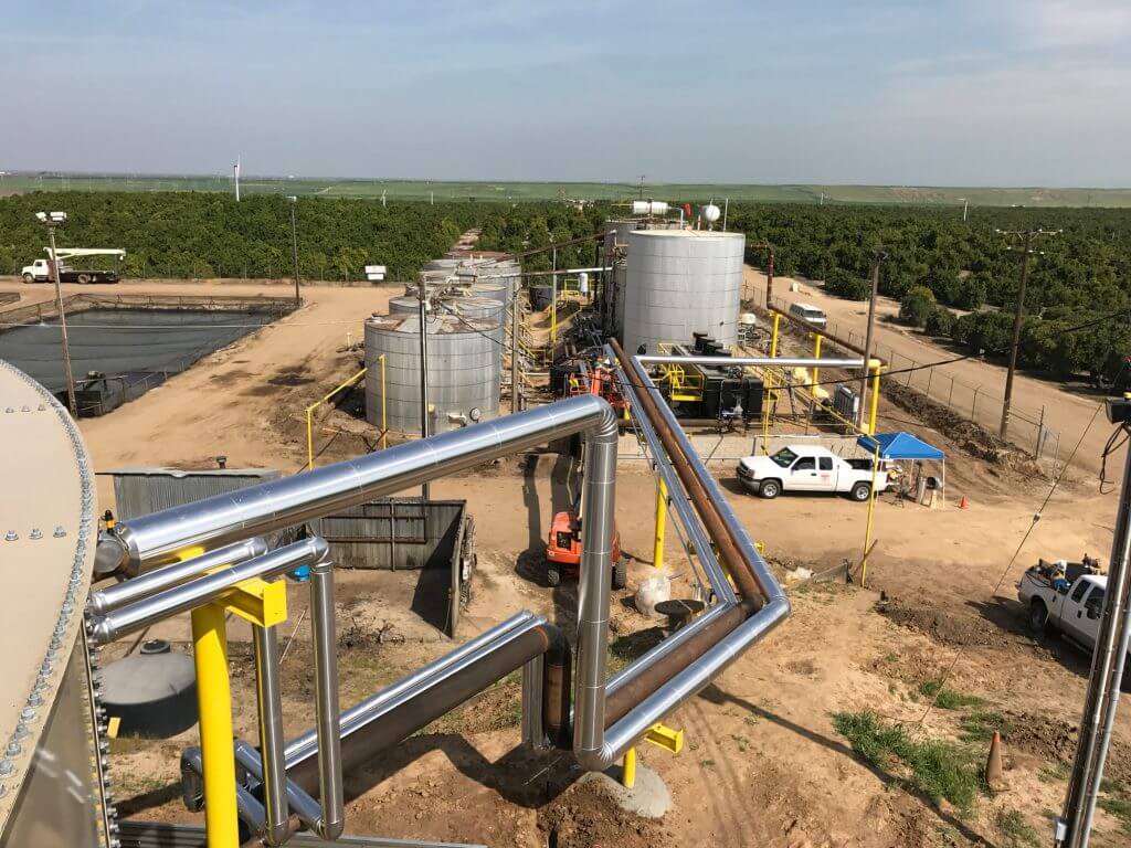 water tank pipes connecting to another tank system with asset management team